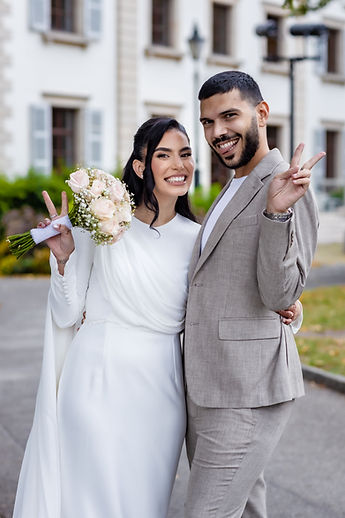 Leila and a loved one flash a V sign