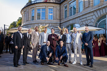 Idrisse and his friends posing in front of the Lausanne Palace