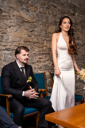 Diamant seated, Albina standing beside him