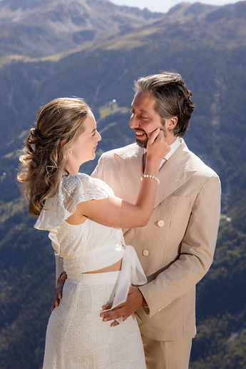 Derek holding Charlotte, the valley below