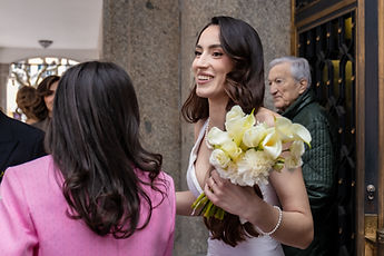 Albina, bouquet in hand, among her loved ones