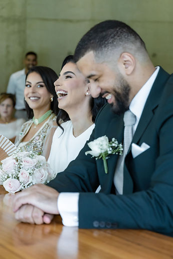 A shared fit of laughter at the ceremony table