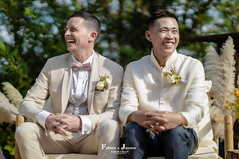 The grooms in fits of laughter during the secular ceremony