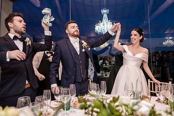 The newlyweds enter the hall as napkins spin in the air