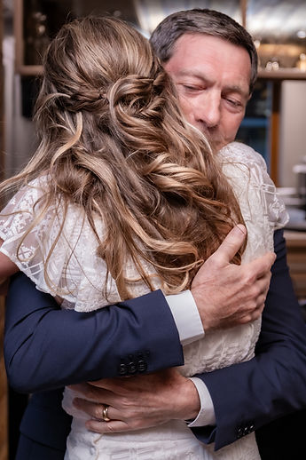 Charlotte in a loved one's arms after a speech