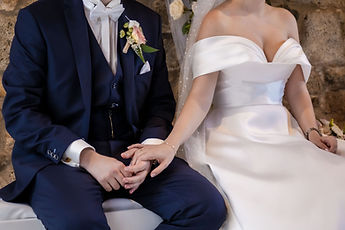 Detail: their hands joined during the ceremony