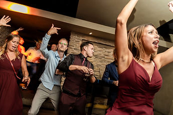 Guests dancing, arms raised
