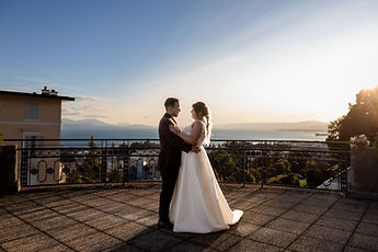 The couple dancing on the terrace at sunset