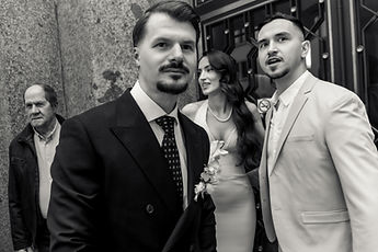 The couple with a loved one, in black and white