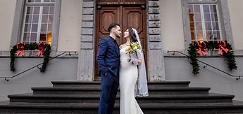 A kiss on the steps, beneath the lit windows