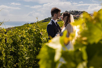 The couple glimpsed through the vine leaves