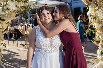 A kiss on the cheek for the bride