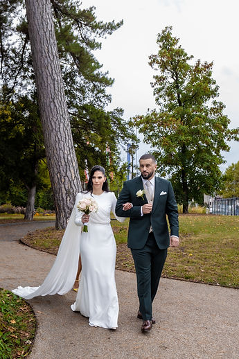 The couple walking in the park, full length