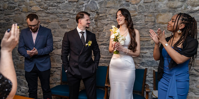 Albina and Diamant smile at each other, applauded by their witnesses, civil wedding at Martigny town hall