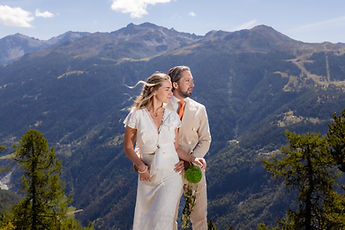 The couple embracing, the mountain range in the background