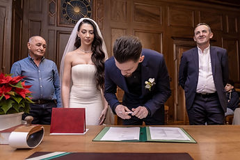 Mersim signing the register