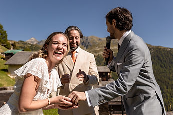 Charlotte laughing as the rings are exchanged