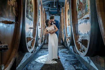 The couple embracing in the Domaine Bovy cellar