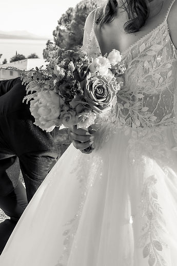 The bride's bouquet and dress, in black and white