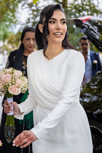 Leila arrives at the town hall, her bouquet of roses in hand