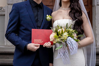 Detail: the red booklet and the bouquet