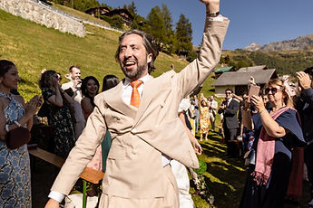 Derek raising his fist, guests applauding