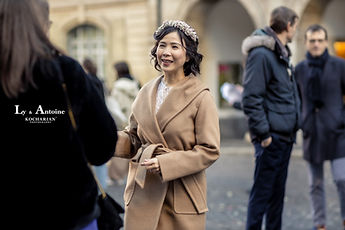 Ly arriving with a smile before the ceremony