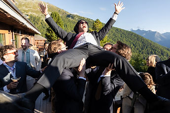 A friend carried in triumph on the terrace
