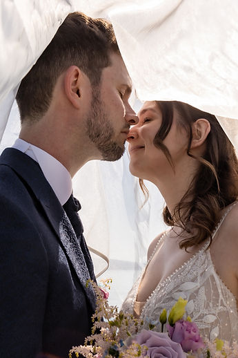 A kiss beneath the veil