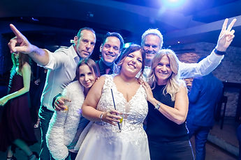 Guests posing around Sabrina on the dance floor