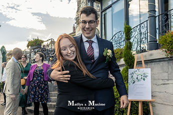 Maxime hugged by a guest, all smiles