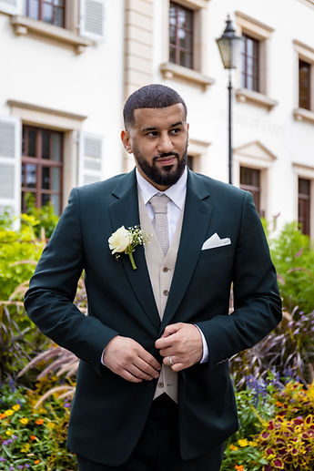 Portrait of Marouan in a dark green suit