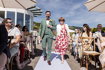 Adrien walks up the aisle on a loved one's arm