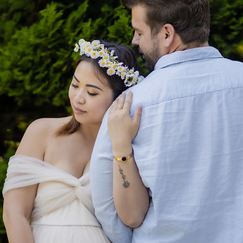 Mother-to-be leaning against her partner's shoulder
