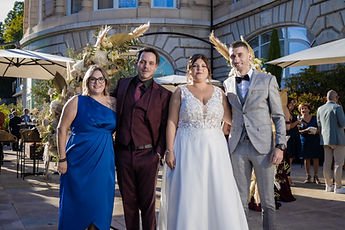 Family photo under the flower arch