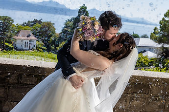 The couple's dip kiss, facing the lake