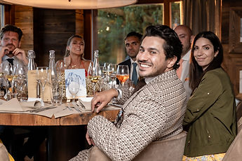 Guests laughing at the table