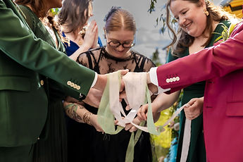 Close-up of the hands and the ribbons