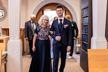 Patrick enters the church on a loved one's arm