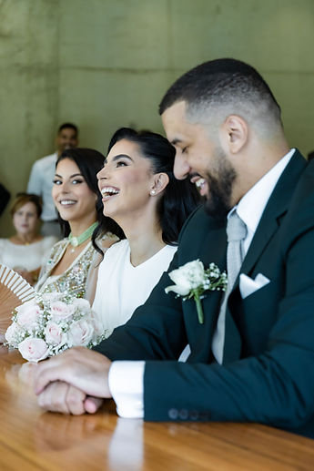Leila and Marouan laugh during the ceremony