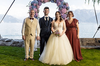 The couple with two loved ones, by the lake