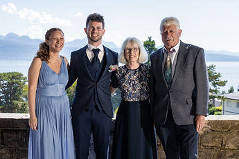 Patrick with three loved ones in front of the lake