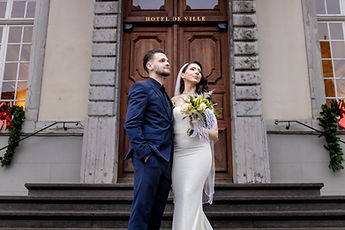 Mersim looking into the distance, Leonora on his arm