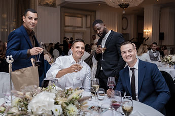 Guests at the table, all smiles