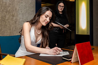 Albina signing the register
