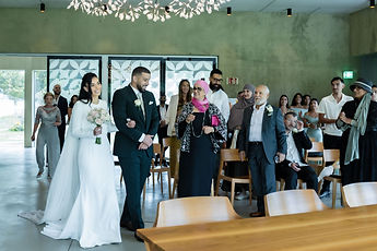 Guests film the couple's entrance
