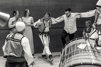 Traditional dance to the drum, in black and white