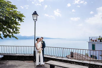 Gemma and Jean at the foot of a lamp post, Lake Geneva as a backdrop
