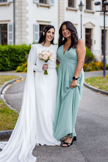 Leila and a friend, all smiles outside the town hall