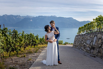 Liliane and Antoine on the vineyard road, the Alps in the distance